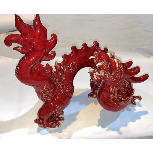 415 - A Chinese red glazed models of a dragon, length 40cm
