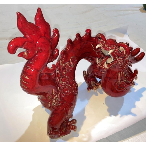 415 - A Chinese red glazed models of a dragon, length 40cm