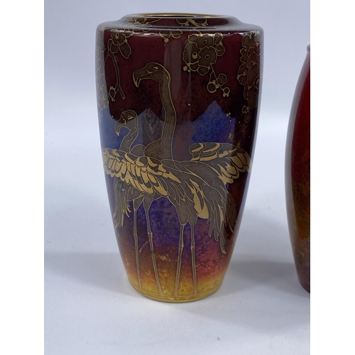 459 - A Royal Doulton Flambe vase designed by Charles Noke,
decorated with gilt highlights of Flamingos an... 