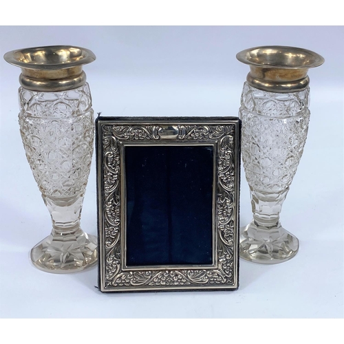 466 - A pair of hall marked silver rimmed hobnail cut glass vases and a small hms photograph frame