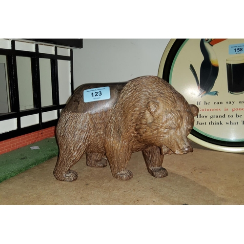 123 - A 'Black Forest' style grizzly bear carved from hardwood with smooth back length 21cm
