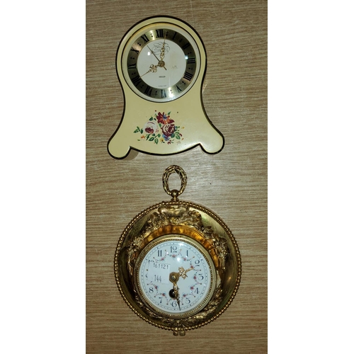 144 - A Louis XVI style ormolu cartel / wall clock with relief decoration and floral porcelain dial and Fr... 