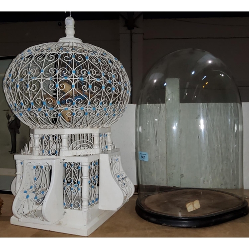 147 - A Victorian oval glass dome (stand does not quite fit); an ornamental bird cage