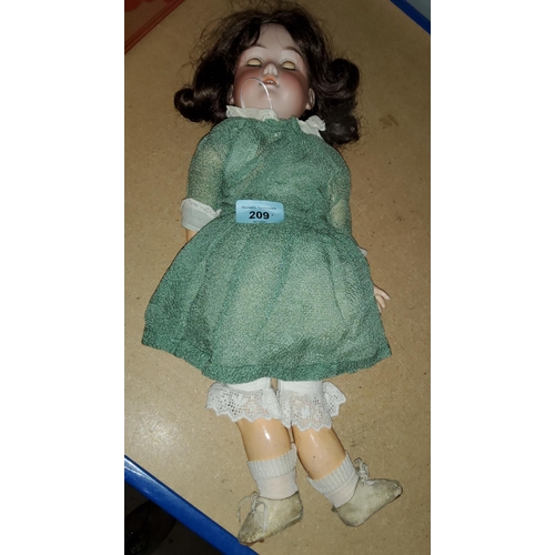 209 - A 19th century German bisque headed doll with composition body, sleepy eyes, marked to back of neck ... 