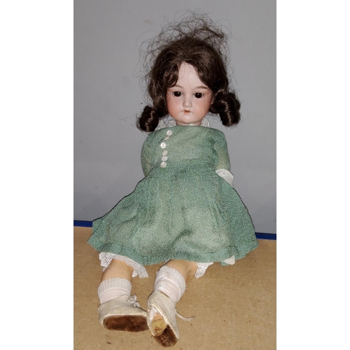 209 - A 19th century German bisque headed doll with composition body, sleepy eyes, marked to back of neck ... 