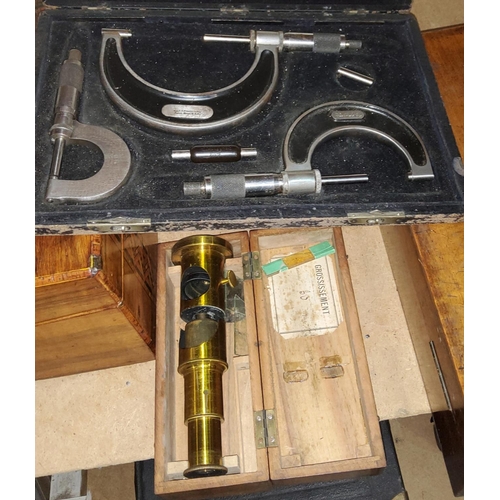 94 - A student's brass field microscope in walnut case, by A Franks; a boxed set of 3 micrometres
