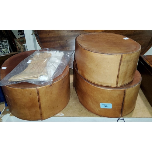 98 - A graduating set of 3 oval storage boxes, polished leather covered, 29-35 cm; 2 pairs of vintage glo... 