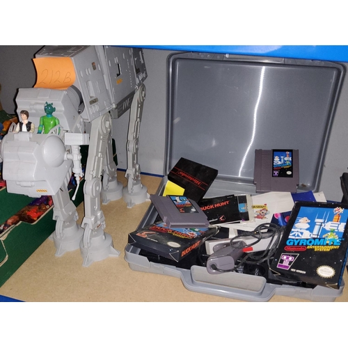 212b - A selection of Nintendo Console accessories, an At-At (incomplete), other toys