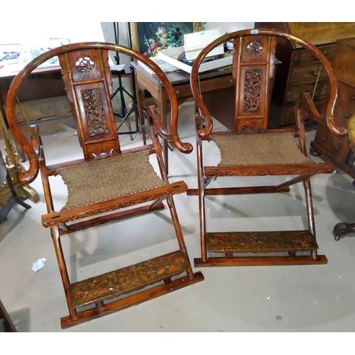 412 - A pair of Chinese hardwood 'Huanghuali' folding horseshoe back armchairs with pierced splats, brass ... 