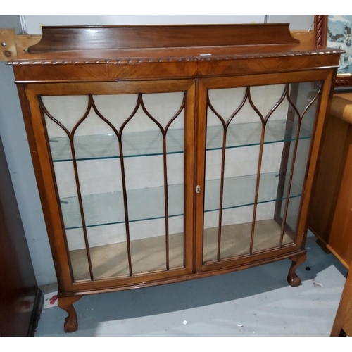926 - A 1920's mahagany display cabinet, enclosed by two astrgal glazed doors on ball and claw feet