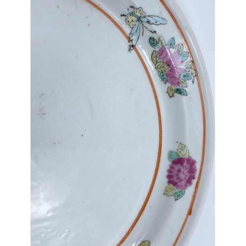 401 - A Chinese dish / stand with polychrome decoration of chrysanthemums, butterflies etc, d. 22.5cm