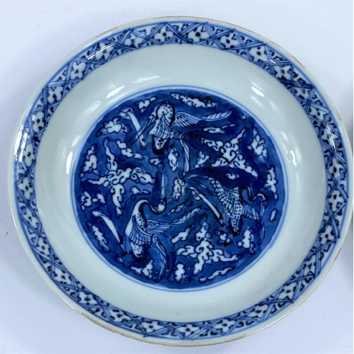 403 - A pair of 18th / 19th century Chinese dishes with blue and white decoration of 3 circling central cr... 