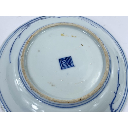 403 - A pair of 18th / 19th century Chinese dishes with blue and white decoration of 3 circling central cr... 