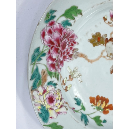 404 - A 19th century Chinese famille rose dish decorated with flowers, a bird on branch and one in flight,... 