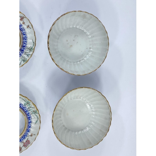 406 - A pair of 19tth century Chinese lidded rice bowls with matching circular rest, of ribbed form with p... 