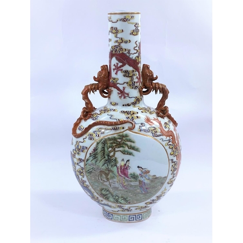 409 - A Chinese Moon flask shaped vase decorated with 
 polychrom panels of traditional scenes, surrounded... 