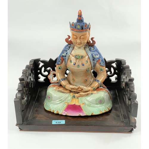 430 - A Chinese ceramic Buddah with polychrome decoration,
seated in lotus postition height 30cm, with ass... 