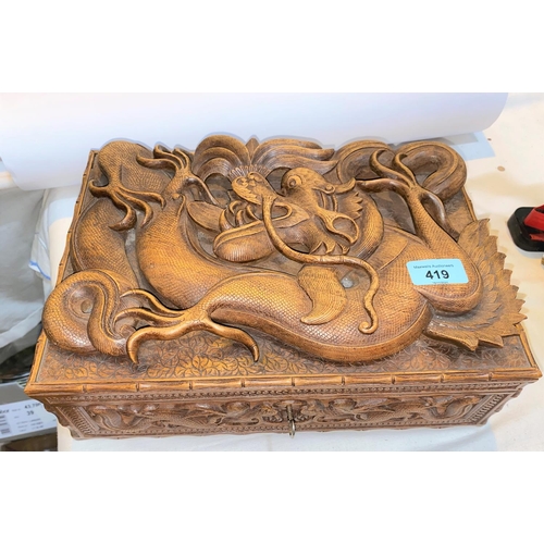419 - A late 19th / early 20th century Chinese carved wood jewellery box with dragon in high relief