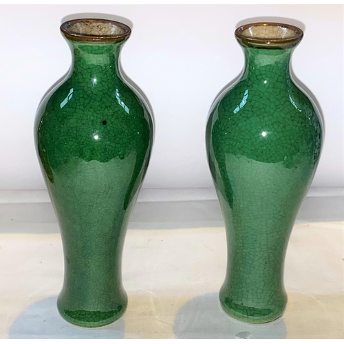 423 - A pair of Chinese monochrome green crackle glaze high
shoulder baluster vases, the rim unglazed, hei... 