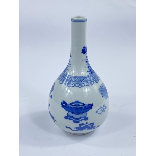 444 - A Chinese blue and white bottle vase decorated with vases
etc, height 17cm