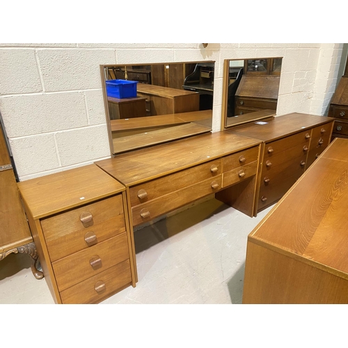 815 - A1960's teak 3 piece bedroom suite comprising 4 drawer dressing table, 8 drawer chest and 4 drawer b... 