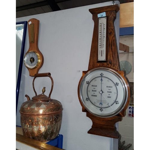 34 - An oak cased aneroid barometer; a 400 day clock; etc.