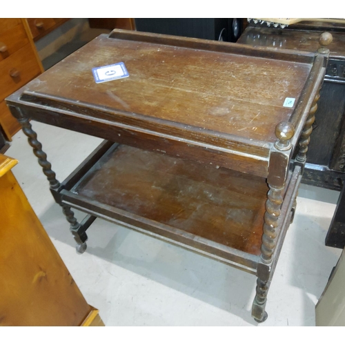 794 - A 1930's oak barleytwist tea trolley with drawer