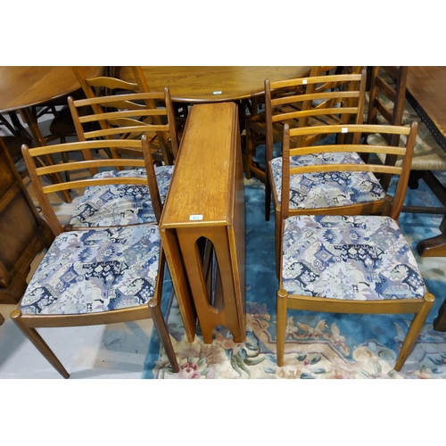 812 - A 1960's teak G-Plan dining suite comprising drop leaf table and 4 ladder back chairs