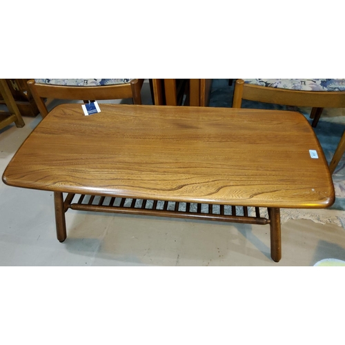837 - An Ercol coffee table with laddered undershelf of rounded rectangular form, length 103cm