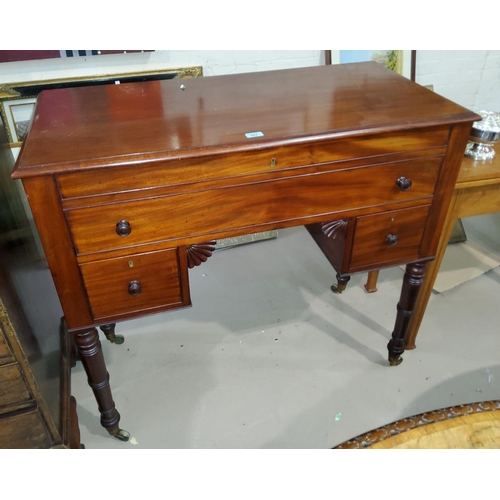 867 - A Regency period mahogany dressing table, with kneehole, rising top, blind drawer front over 2 lower... 