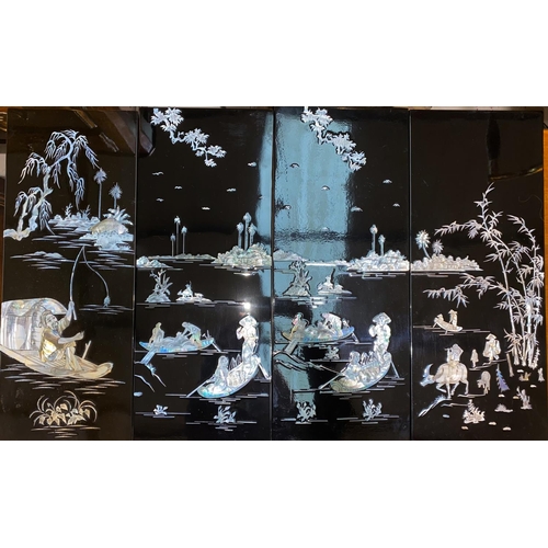 408 - A set of four lacquer Japanese mother of pearl, inlaid panels with country scenes.
