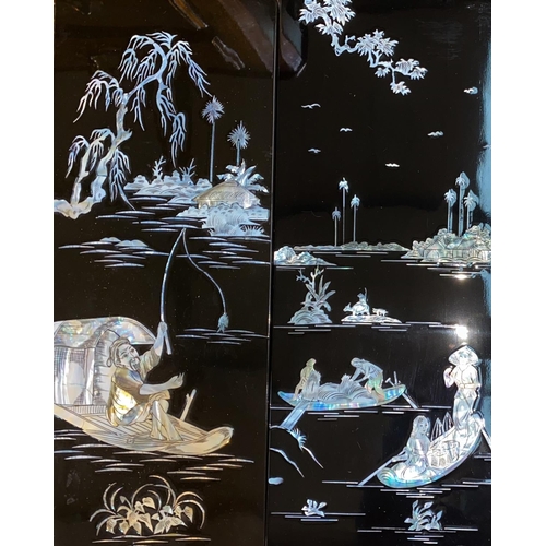 408 - A set of four lacquer Japanese mother of pearl, inlaid panels with country scenes.