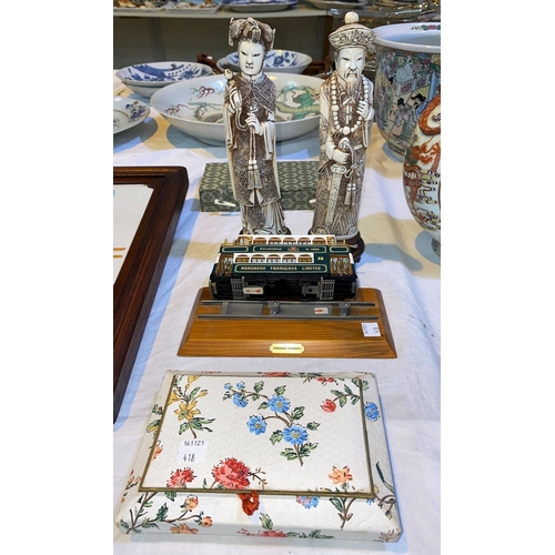 418 - A pair of Chinese simulated ivory figures of a man and woman; a model of a Hong Kong train on rails;... 