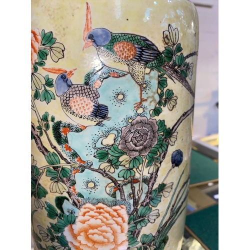 449 - A large Chinese famille verte rouleau vase with yellow ground,
decoration of birds on branches, heig... 