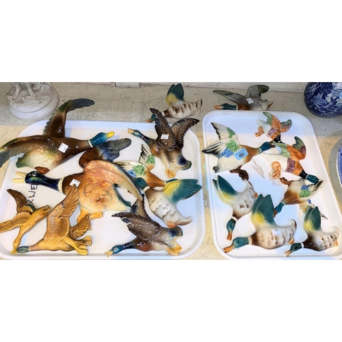 482 - A Victorian Parian ware figure of a woman and a large collection of 1930's wall mounted flying ducks