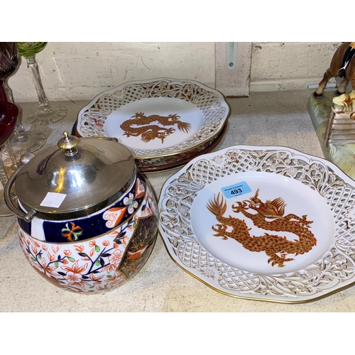 493 - A Royal Crown Derby biscuit barrel, a pair Doulton Lambeth plates and a pair of dragon collector's p... 
