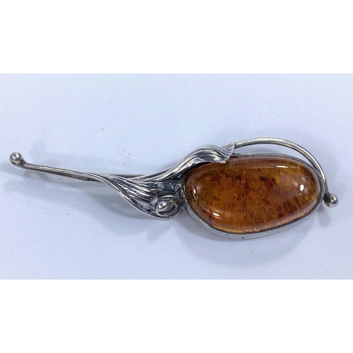 545A - A white metal  Art Nouveau style brooch with leaves and an amber main stone to the centre stamped 92... 