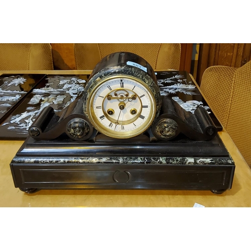 801 - A Victorian mantel clock in black and variegated marble drum shaped case, with French striking movem... 