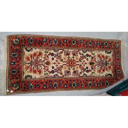 805 - A Chinese rug with floral pattern on blue ground; a modern Persian rug with cream ground