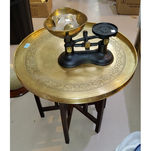 811 - Two occasional tables with brass tops; a set of vintage scales; brassware