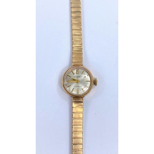 613 - A ladies Summit wristwatch on 9 carat hallmarked gold bracelet, 15.3 gm gross