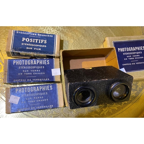187 - A series of French stereo photographs and viewer; 2 boxes of lantern slide photos with letter sugges... 