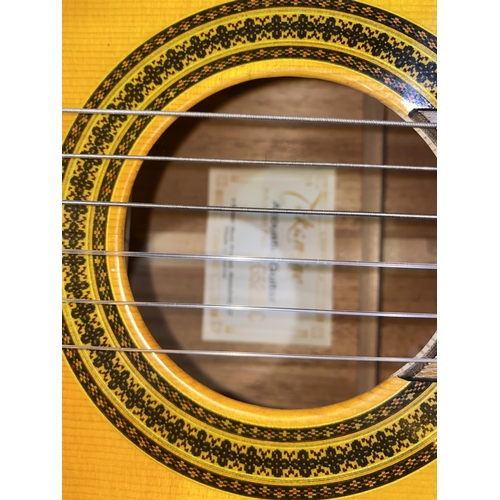 321 - A cut away classical guitar by Takamine, with hard carry case - The instrument seems in good order a... 