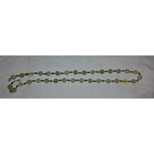 635A - An apple jade coloured necklace