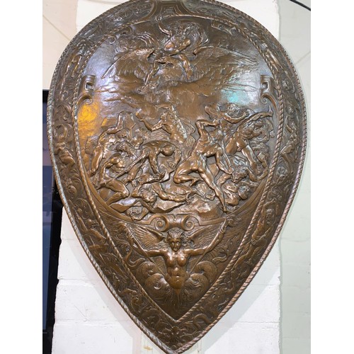 50 - A late 19th/early 20th century unusual bronzed shield decorated in relief with classical scene:  Zeu... 