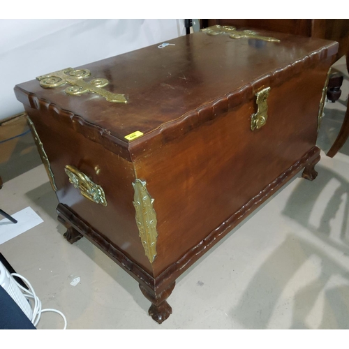 839 - An impressive reproduction continental style chest with hinged lid with large brass hinges, handles ... 