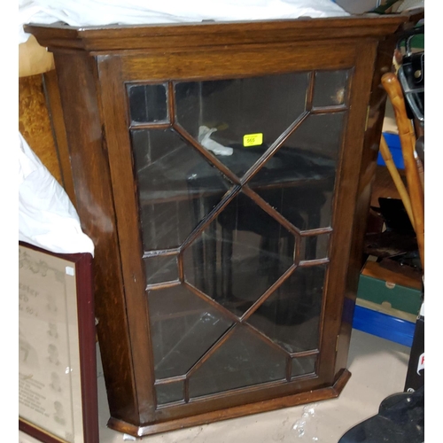 835 - A 19th century oak straight front cupboard enclosed by astral glazed door