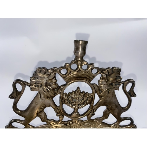 131 - A silvered metal Hanukkah light -Menorah with twin lions rampant width 21cm
