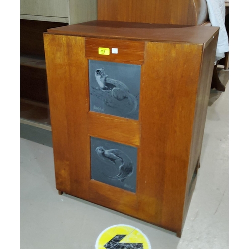 904 - A 1960's teak record cabinet with slate tiles to the front decorated with animals; a 1960's tile top... 