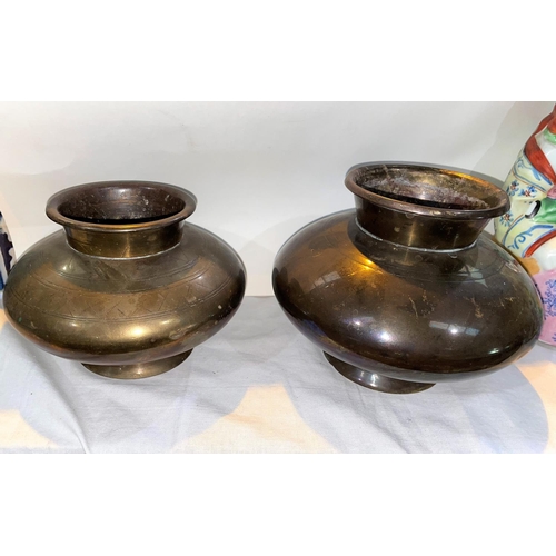 407 - Two Indian brass water pots of squat bulbous form with some areas of decoration, height 12cm